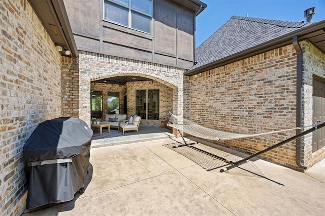 view of patio featuring outdoor lounge area and a grill