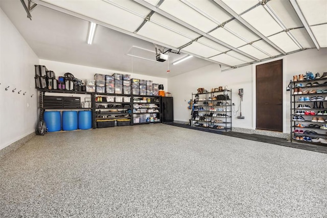garage featuring baseboards and a garage door opener