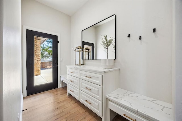 mudroom with light wood-style floors