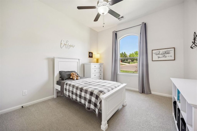 bedroom featuring light colored carpet, baseboards, visible vents, and ceiling fan