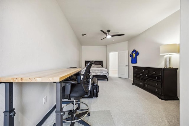 carpeted office with baseboards, ceiling fan, and visible vents