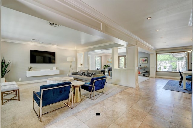 living area featuring visible vents, ornamental molding, baseboards, and recessed lighting