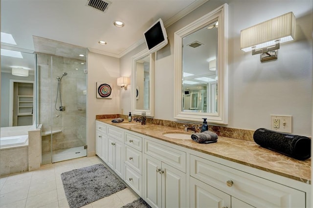 full bathroom featuring double vanity, tile patterned flooring, a stall shower, and visible vents