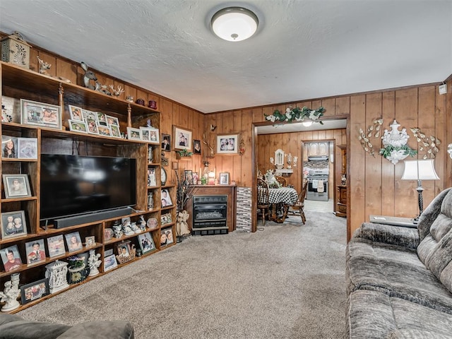 living room with carpet flooring and wood walls
