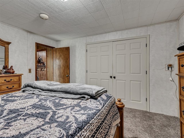 carpeted bedroom with a closet