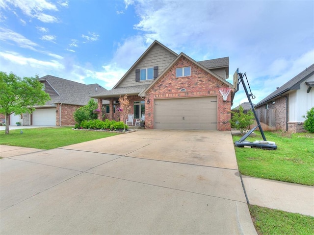 craftsman-style house featuring brick siding, an attached garage, driveway, and a front lawn