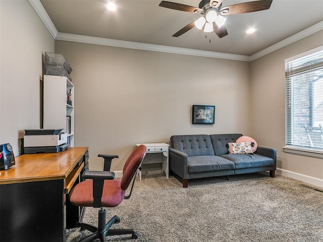 carpeted home office featuring baseboards, ornamental molding, ceiling fan, and visible vents