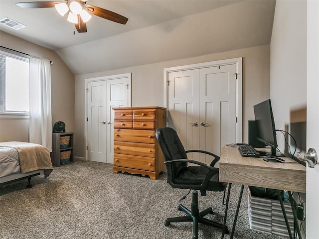 office with carpet floors, a ceiling fan, lofted ceiling, and visible vents