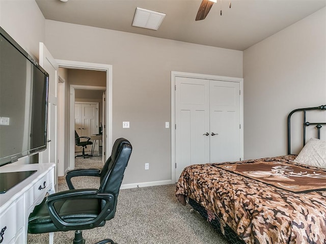 bedroom featuring a ceiling fan, visible vents, baseboards, a closet, and carpet flooring