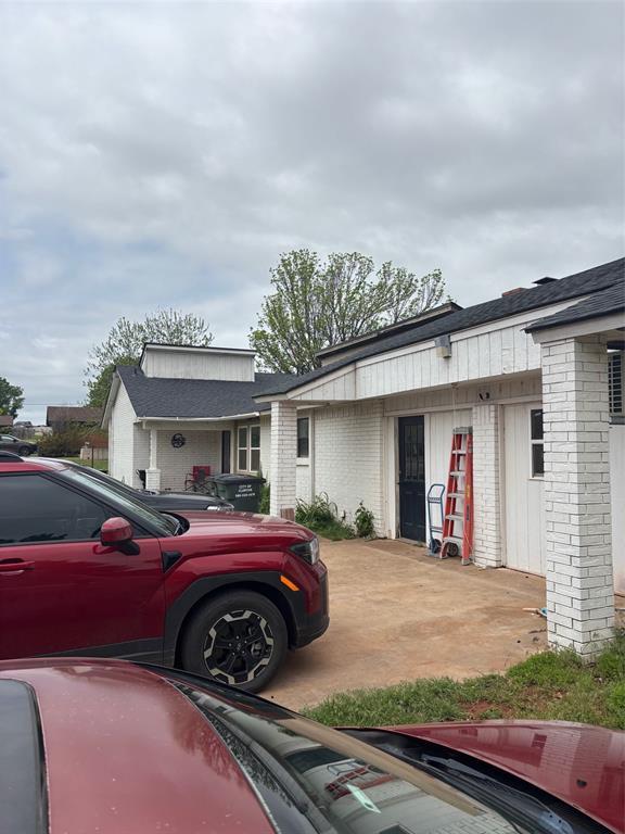 view of front of house with brick siding