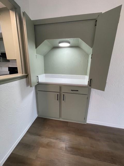 bathroom featuring wood finished floors and baseboards