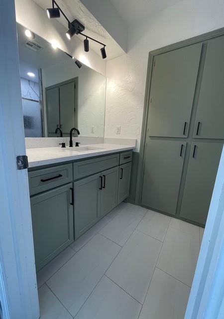 bathroom with visible vents and vanity