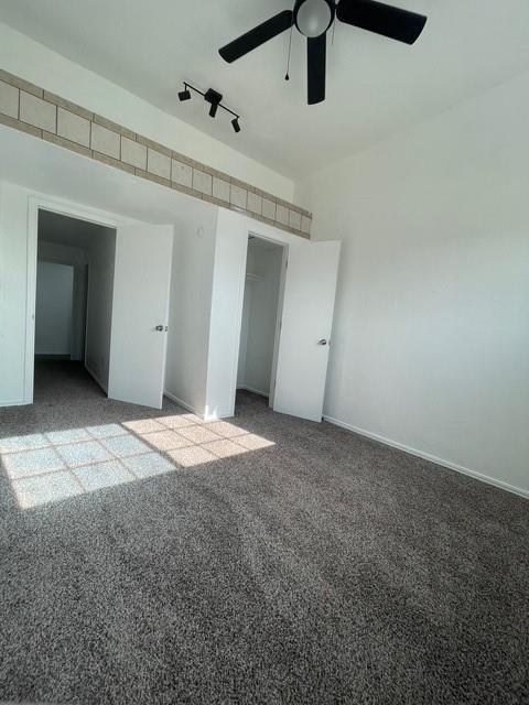 unfurnished bedroom with a ceiling fan, carpet flooring, and a closet
