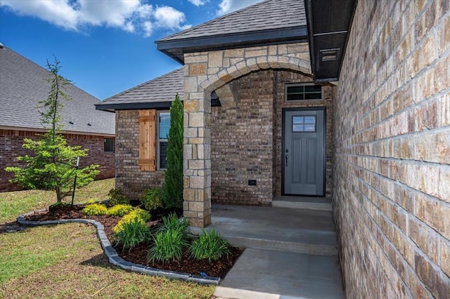 11608 NW 104th St, Yukon, OK 73099 - doorway to property with roof with shingles and brick siding