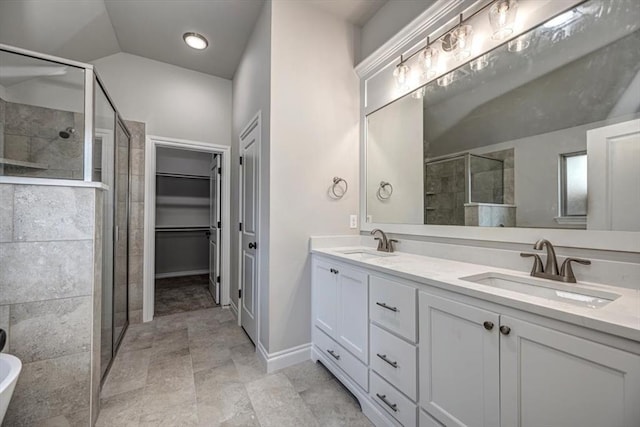 11608 NW 104th St, Yukon, OK 73099 - full bath with baseboards, a shower stall, double vanity, and a sink