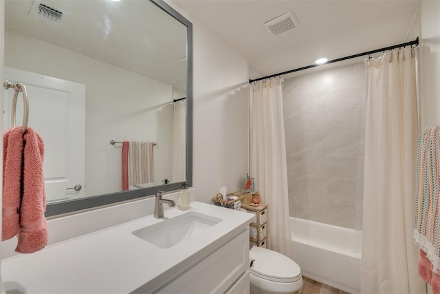 full bathroom with visible vents, shower / tub combo with curtain, toilet, and vanity