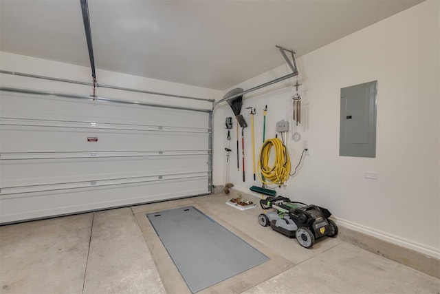 garage featuring baseboards and electric panel