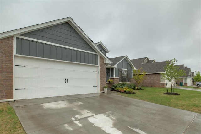 view of front of property with brick siding, a garage, board and batten siding, a front yard, and driveway