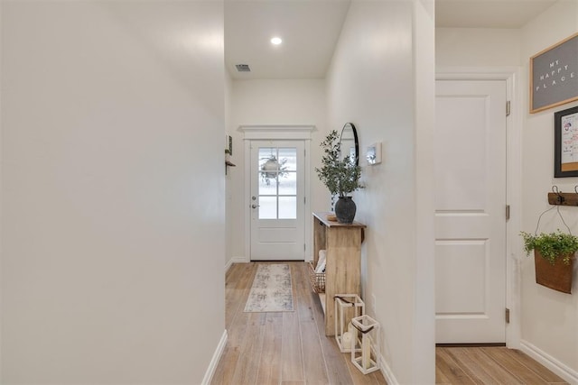 9304 NW 89th St, Yukon, OK 73099 - doorway with light wood finished floors and recessed lighting