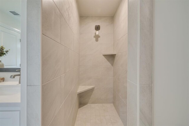 9304 NW 89th St, Yukon, OK 73099 - bathroom featuring tiled shower and vanity