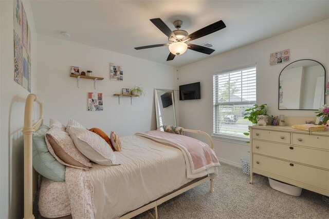9304 NW 89th St, Yukon, OK 73099 - bedroom featuring light colored carpet and ceiling fan
