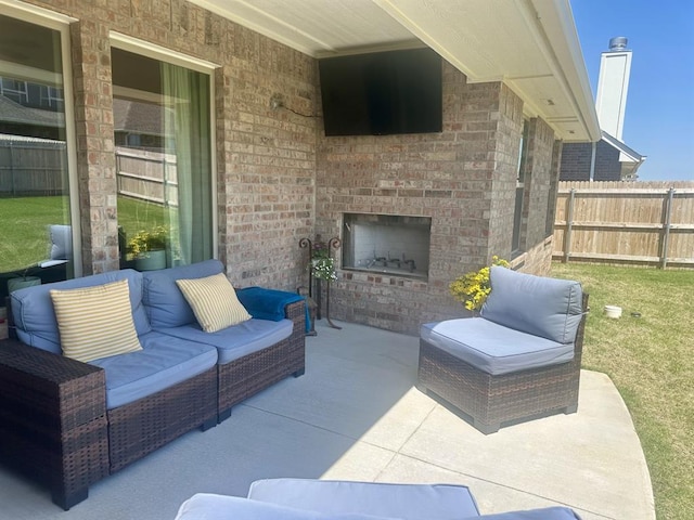 9304 NW 89th St, Yukon, OK 73099 - view of patio / terrace with an outdoor living space with a fireplace