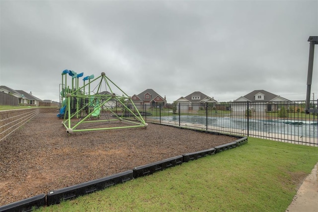9304 NW 89th St, Yukon, OK 73099 - community play area featuring a residential view