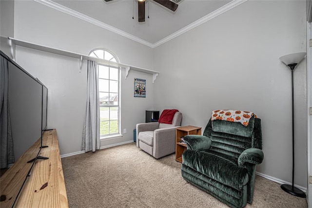 sitting room with crown molding, high vaulted ceiling, carpet flooring, and a healthy amount of sunlight