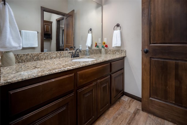 bathroom featuring vanity and wood finished floors