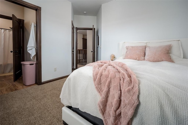 carpeted bedroom with baseboards