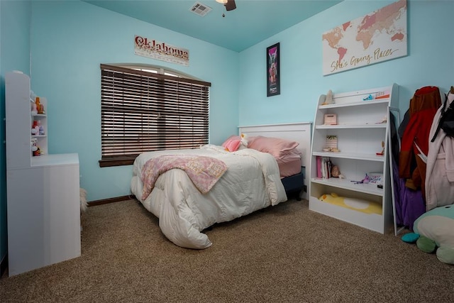 bedroom featuring visible vents, carpet flooring, and a ceiling fan