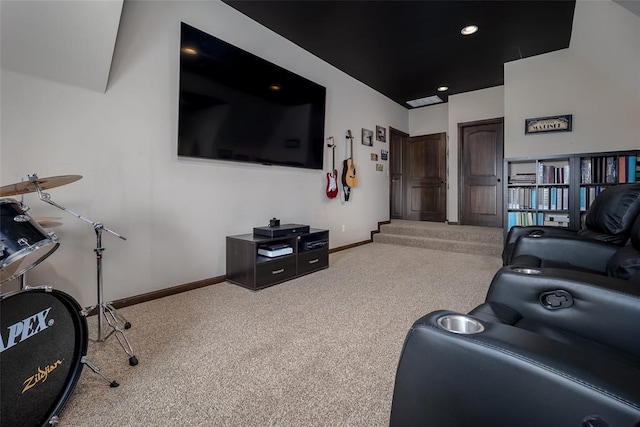 carpeted living area featuring baseboards and recessed lighting