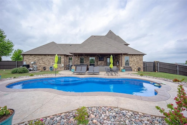 view of swimming pool with a fenced backyard, a fenced in pool, a patio, and a yard