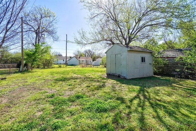 2132 N Kelham Ave, Oklahoma City, OK 73111 - view of yard featuring fence, an outbuilding, and a shed