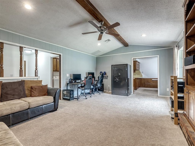 living room featuring ceiling fan, washer / clothes dryer, visible vents, carpet floors, and lofted ceiling with beams