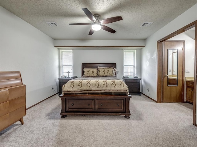 bedroom featuring visible vents, multiple windows, and light colored carpet