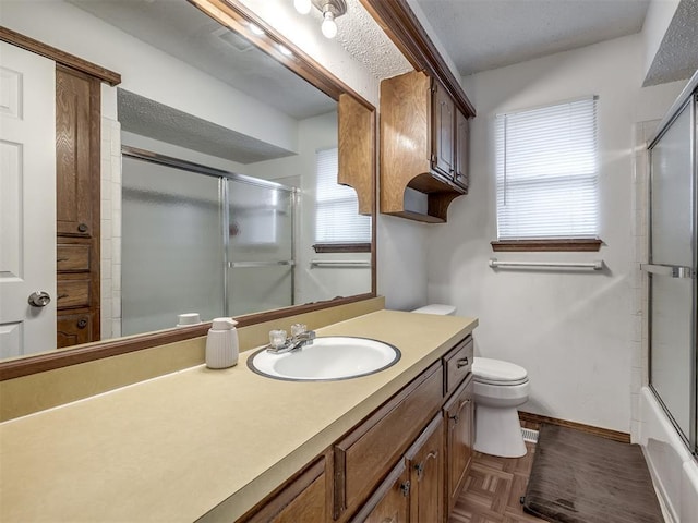 full bath featuring vanity, plenty of natural light, baseboards, and toilet