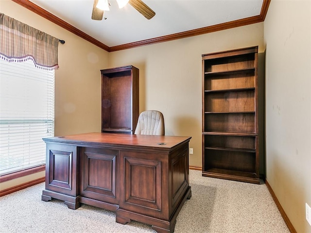 office featuring ceiling fan, light carpet, baseboards, and ornamental molding