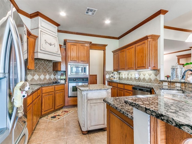 kitchen featuring a sink, tasteful backsplash, ornamental molding, and stainless steel appliances