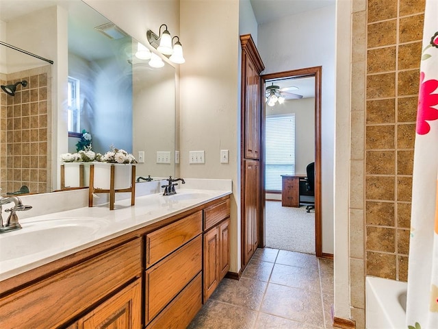 bathroom with double vanity, visible vents, a sink, and tile patterned flooring