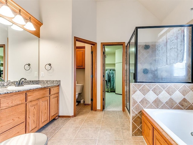 bathroom with vanity, high vaulted ceiling, tile patterned floors, a bath, and a stall shower