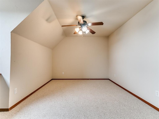 bonus room with a ceiling fan, baseboards, vaulted ceiling, and carpet