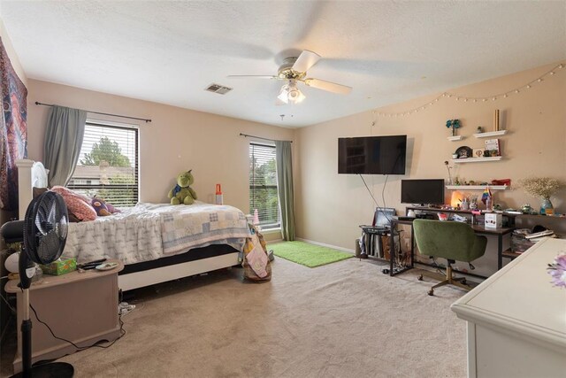 bedroom featuring baseboards, multiple windows, carpet, and visible vents