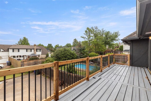 deck with a fenced backyard and a residential view