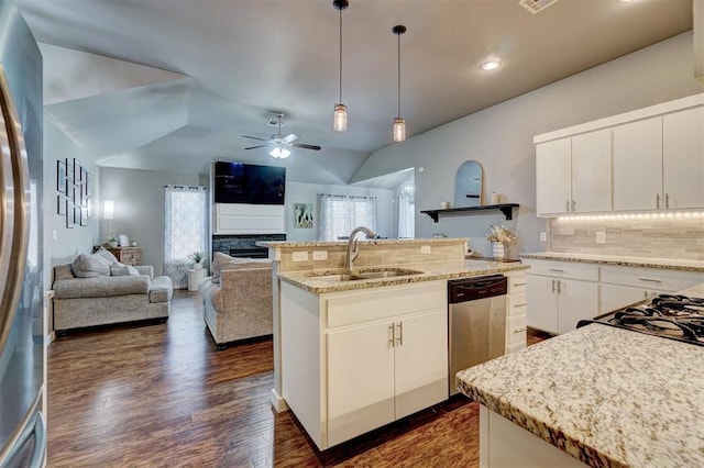 kitchen with ceiling fan, a sink, dishwasher, decorative light fixtures, and tasteful backsplash