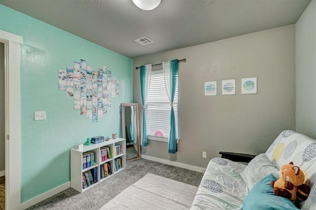 bedroom with visible vents, baseboards, and carpet floors