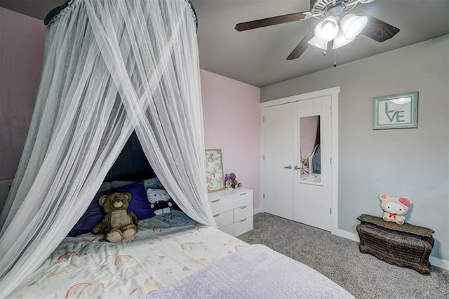 bedroom with a ceiling fan, baseboards, and carpet