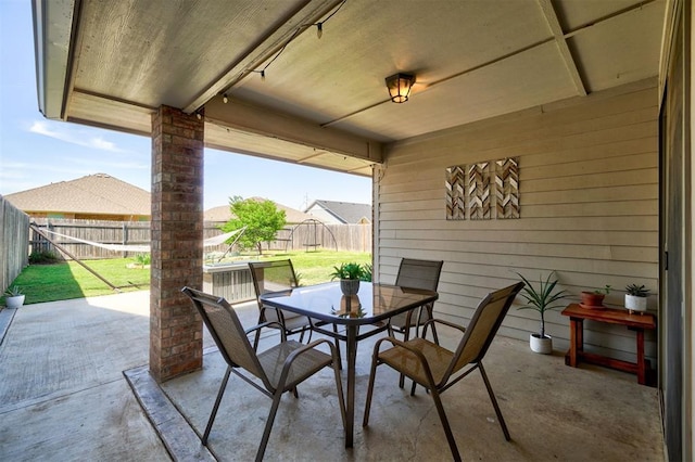 view of patio featuring a fenced backyard and outdoor dining area