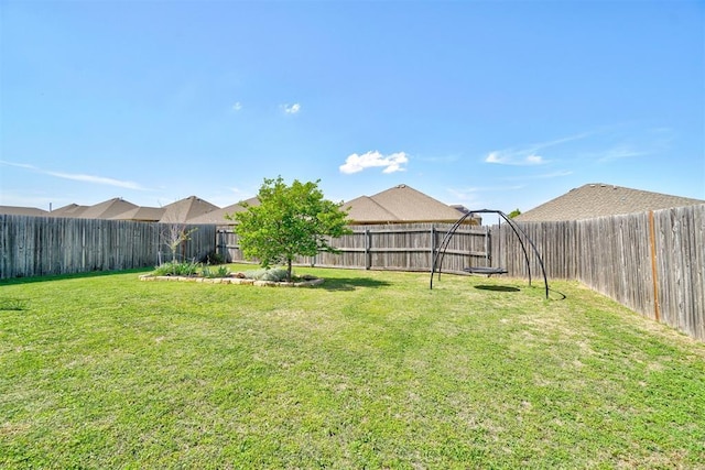 view of yard featuring a fenced backyard
