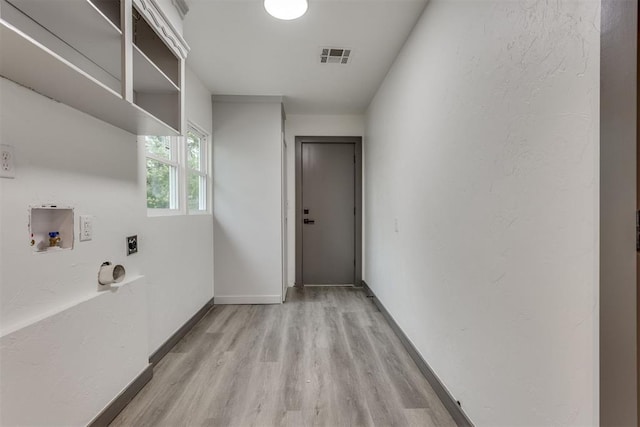 laundry room with washer hookup, laundry area, light wood-style flooring, electric dryer hookup, and visible vents